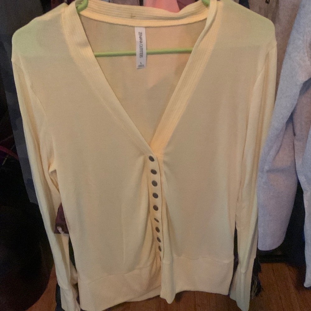 Brand new light pale yellow cardigan size large! Light weight knit material